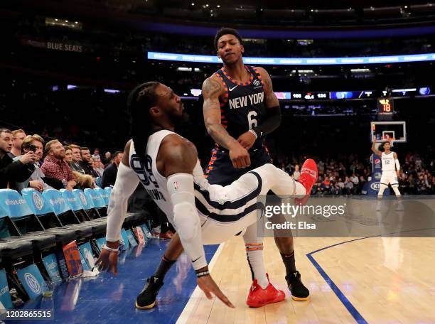 Elfrid Payton of the New York Knicks shoves Jae Crowder of the Memphis Grizzlies after he attempted a three point shot in the final minutes of the...