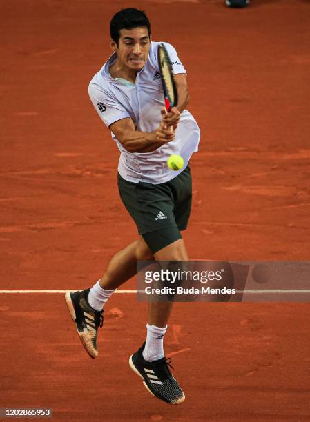 Cristian Garin of Chile returns a shot to Gianluca Mager of Italy during the men's singles final match of the ATP Rio Open 2020 at Jockey Club...