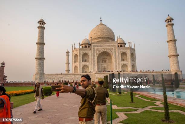 On duty Indian policemen take their selfie in the premises of, Taj Mahal on February 23, 2020 in Agra, India. Authorities have made elaborate...