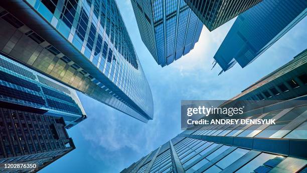 corporate building in sky. business background - bank financieel gebouw stockfoto's en -beelden