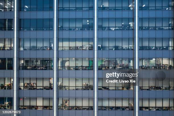 office building facade at night - office facade stock pictures, royalty-free photos & images