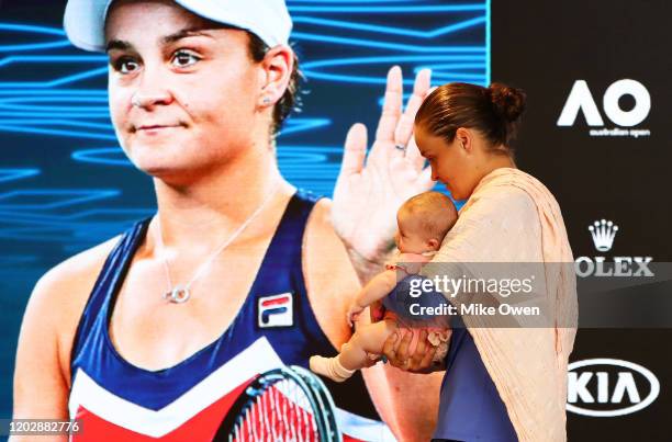 Ashleigh Barty of Australia holds her niece Olivia during a press conference after defeat in her Women's Singles Semifinals match against Sofia Kenin...