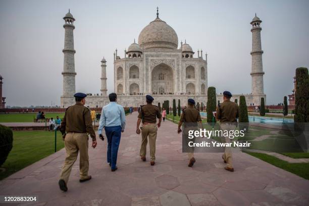 Indian police officers stand guard in the premises of the Taj Mahal on February 23, 2020 in Agra, India. Authorities have made elaborate security...