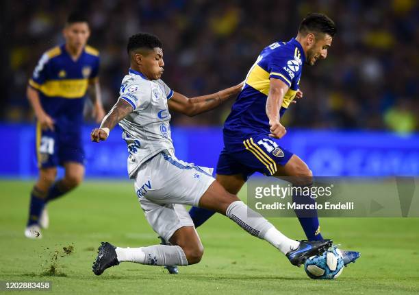 Eduardo Salvio of Boca Juniors fights for the ball with Wilder Cartagena of Godoy Cruz during a match between Boca Juniors and Godoy Cruz as part of...