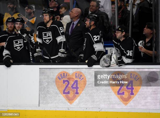 The Los Angeles Kings bench look to the ice, behind a Kobe Bryant and Gigi tribute on the boards, during a 4-2 Tampa Bay Lightning win at Staples...