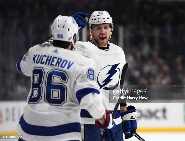 Erik Cernak of the Tampa Bay Lightning celebrates his goal with Nikita Kucherov, for a 3-2 lead, during a 4-2 Lightning win over the Los Angeles...