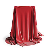 Empty podium covered with red silk cloth. Isolated on a white background with clipping path.
