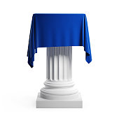 Empty podium covered with blue cloth. Isolated on a white background with clipping path.