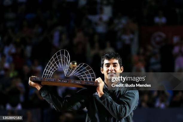 Cristian Garin of Chile celebrates with the trophy after defeating Gianluca Mager of Italy at the men's singles final match of the ATP Rio Open 2020...