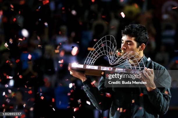 Cristian Garin of Chile celebrates with the trophy after defeating Gianluca Mager of Italy at the men's singles final match of the ATP Rio Open 2020...