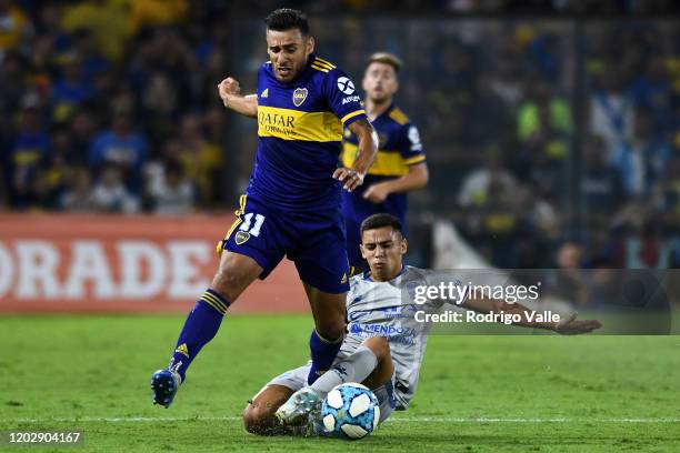 Wilmar Cartagena of Godoy Cruz competes for the ball with Eduardo Salvio of Boca Juniors during a match between Boca Juniors and Godoy Cruz as part...