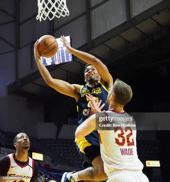 Ben Moore of the Fort Wayne Mad Ants battles Dean Wade of the Canton Charge on February 23, 2020 at Memorial Coliseum in Fort Wayne, Indiana. NOTE TO...