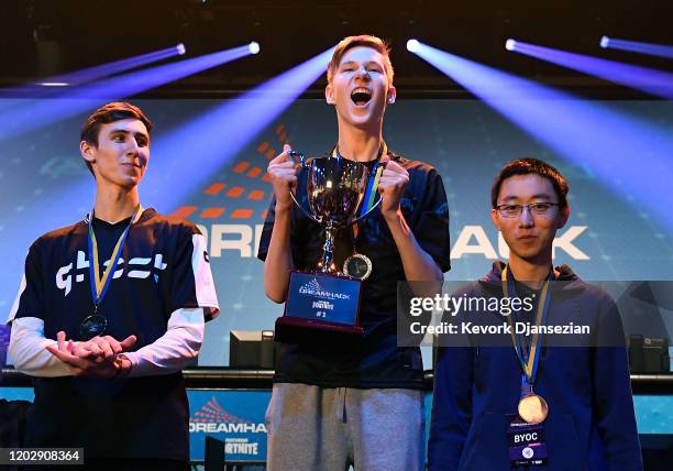 Martin "MrSavage" Foss Andersen, a player for 100 Thieves, holds the championship trophy after winning DreamHack Anaheim featuring Fortnite during...