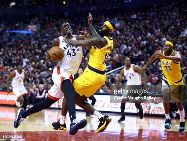 Pascal Siakam of the Toronto Raptors dribbles the ball as JaKarr Sampson of the Indiana Pacers defends during the second half of an NBA game at...
