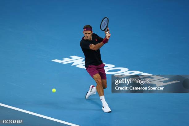 Roger Federer of Switzerland plays a backhand during his Men's Singles Semifinal match against Novak Djokovic of Serbia on day eleven of the 2020...