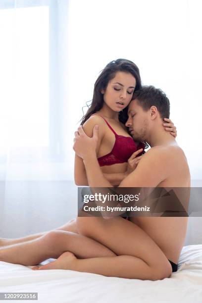 Loving couple enjoying intimate moments in the bed