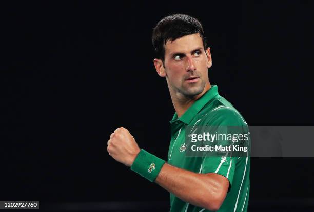 Novak Djokovic of Serbia celebrates after winning set point during his Men's Singles Semifinal match against Roger Federer of Switzerland on day...