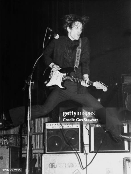 English guitarist, singer and songwriter Wilko Johnson performing live with pub rock band Dr Feelgood, circa 1976.