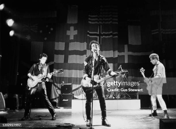British musicians Mick Jones, Joe Strummer and Paul Simonon of punk band The Clash perform on stage in London, UK, 1978.