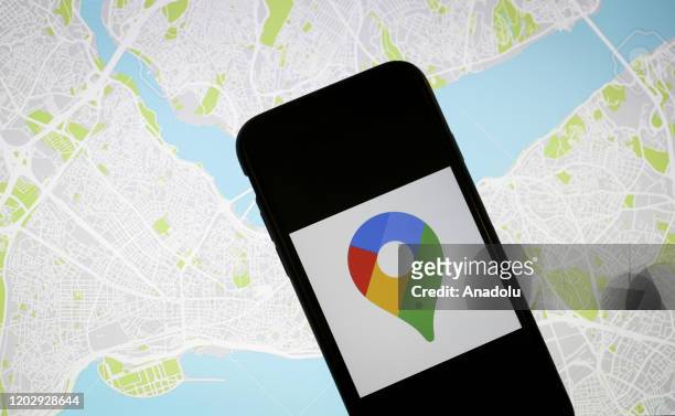 In this photo illustration a computer shows a map of New York while a mobile phone screen displays Google Maps logo in Ankara, Turkey on February 21,...