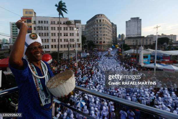 Revellers attend the parade of the street carnival group Afoxe Filhos de Gandhy in Salvador, Bahia state, on February 23, 2020. - Afoxe Filhos de...