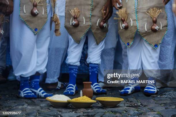 Revellers attend the parade of the street carnival group Afoxe Filhos de Gandhy in Salvador, Bahia state, on February 23, 2020. Afoxe Filhos de...