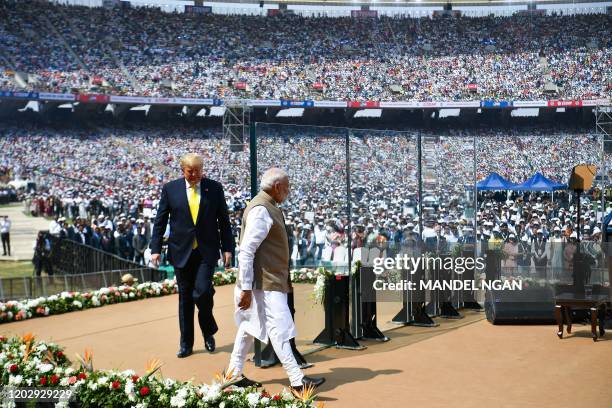 President Donald Trump and India's Prime Minister Narendra Modi arrive to attend 'Namaste Trump' rally at Sardar Patel Stadium in Motera, on the...