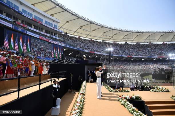 President Donald Trump, First Lady Melania Trump and India's Prime Minister Narendra Modi wave during 'Namaste Trump' rally at Sardar Patel Stadium...