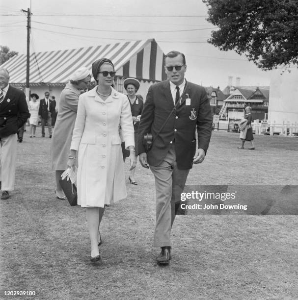 Princess Grace of Monaco walks with her brother John B. Kelly Jr as they attend the Henley Royal Regatta at Henley-on-Thames in Oxfordshire, England...