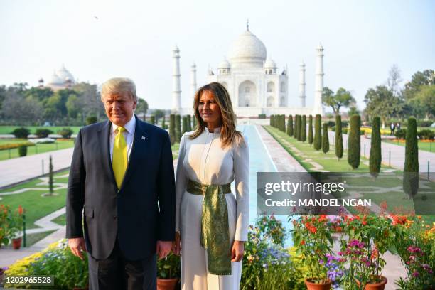 President Donald Trump and First Lady Melania Trump pose as they visit the Taj Mahal in Agra on February 24, 2020.