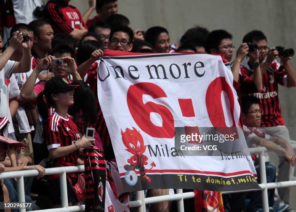 Milan supporters show their support a training session ahead of the match against Inter Milan at the Olympic Sports Center on August 3, 2011 in...