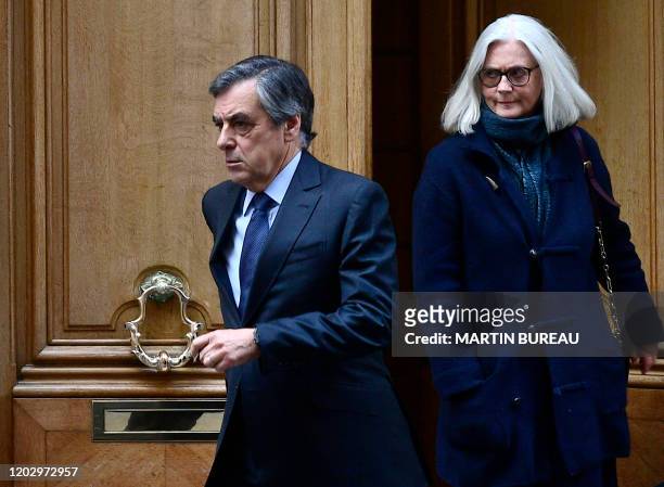 Former French prime minister Francois Fillon and his wife Penelope leave their home on February 24, 2020 in Paris. - Francois Fillon goes on trial...