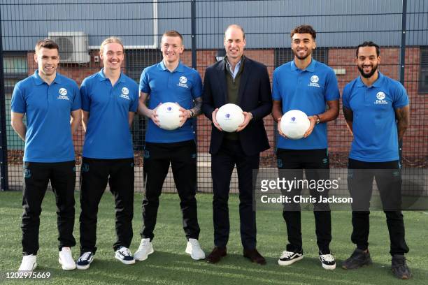 Prince William, Duke of Cambridge poses with players of Everton F.C. Seamus Coleman, Tom Davies, Jordan Pickford, Theo Walcott and Dominic...