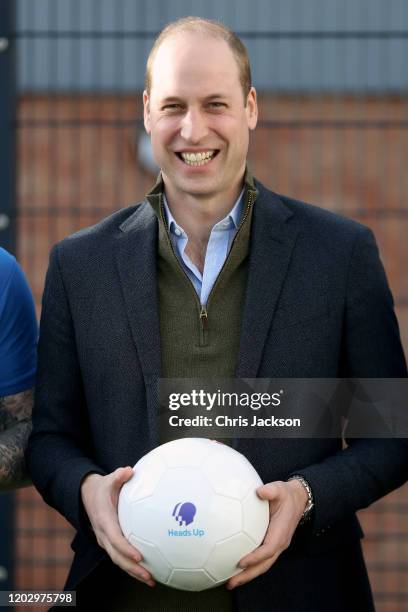 Prince William, Duke of Cambridge poses with players of Everton F.C. During his visit Everton Football Club's official charity Everton in the...