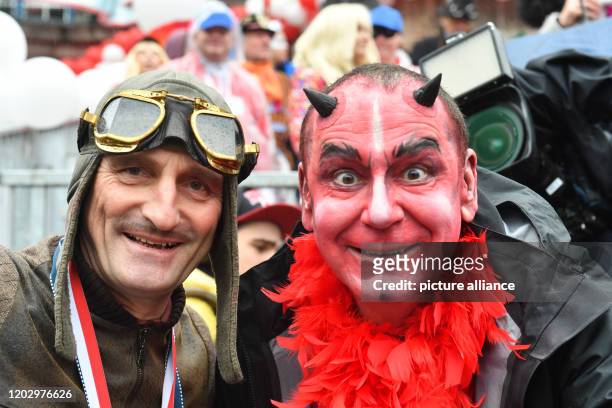 February 2020, North Rhine-Westphalia, Duesseldorf: Mayor Thomas Geisel and cartwright Jacques Tilly are standing at the Rosenmontag procession and...