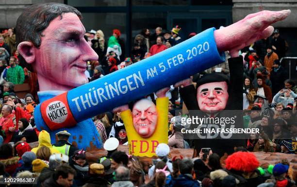 Carnival float depicts Bjoern Hoecke , regional leader in Thuringia of Germany's far-right Alternative for Germany party, supported by Mike Mohring...