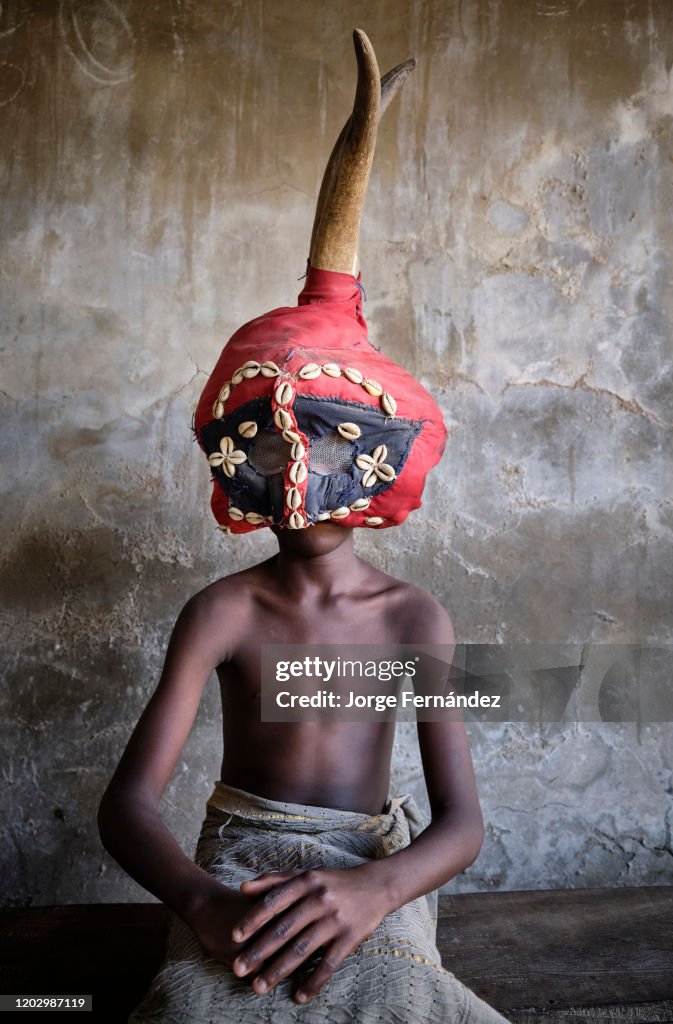 Boy in a traditional ceremonial costume of the Yoruba...