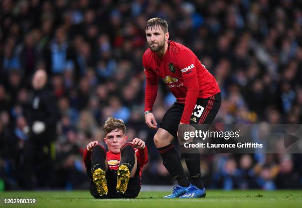 Brandon Williams and Luke Shaw of Manchester United look dejected during the Carabao Cup Semi Final match between Manchester City and Manchester...