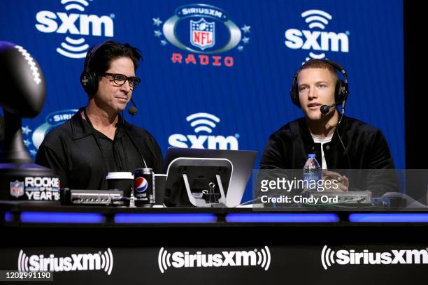 SiriusXM host Ed McCaffrey and NFL running back, Christian McCaffrey of the Carolina Panthers speak onstage during day 2 of SiriusXM at Super Bowl...