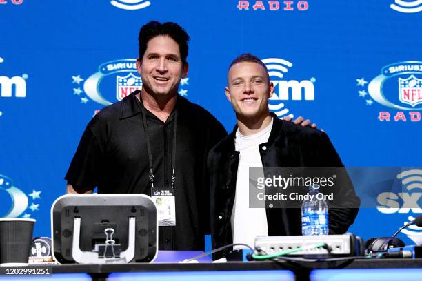 SiriusXM host Ed McCaffrey and NFL running back, Christian McCaffrey of the Carolina Panthers take photos during day 2 of SiriusXM at Super Bowl LIV...