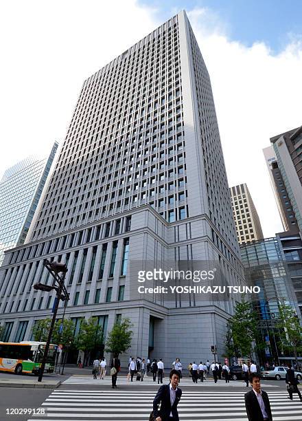 This picture shows Japanese electronics giant Hitachi's head office, located in the upper part of the building in Tokyo on August 4, 2011. Japanese...