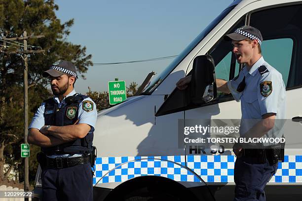 Police cordon off the street where Madeleine Pulver, age 18, endured a horrifying 10-hour ordeal after a masked man strapped a device around her neck...