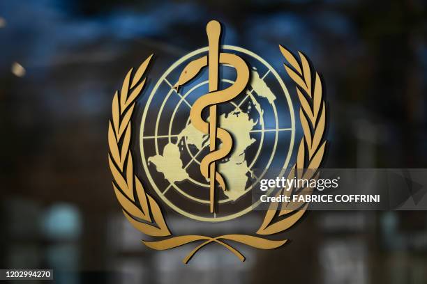 Photo taken on February 24, 2020 shows the logo of the World Health Organization at their headquarters in Geneva. - Fears of a global coronavirus...