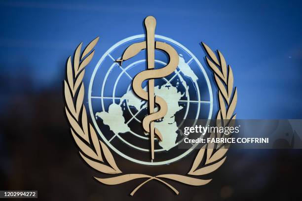 Photo taken on February 24, 2020 shows the logo of the World Health Organization at their headquarters in Geneva. - Fears of a global coronavirus...