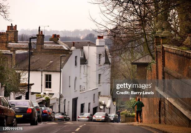 Man jogging down Highgate West Hill on 25th March 2007, Highgate, London, United Kingdom. The village is at the top of North Hill with views across...