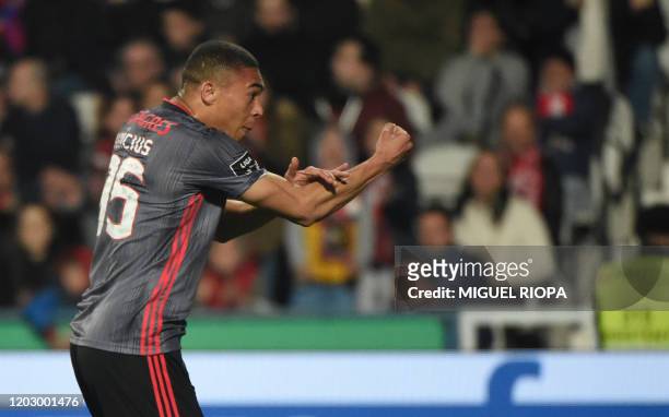 Benfica's Brazilian forward Carlos Vinicius celebrates after scoring a goal during the Portuguese league football match between Gil Vicente FC and SL...