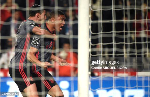 Benfica's Brazilian forward Carlos Vinicius celebrates after scoring a goal during the Portuguese league football match between Gil Vicente FC and SL...