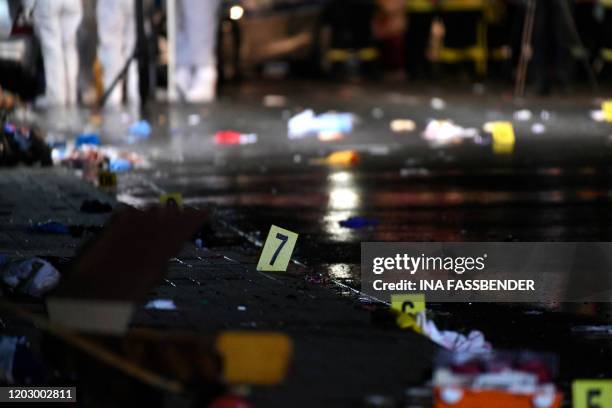 Forensics numbers are seen at the place where a man drove into a carnival procession on February 24, 2020 in Volkmarsen near Kassel, central Germany....