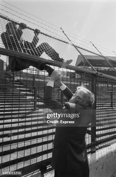 British businessman, football executive and hotelier Ken Bates with a man, Dick Murry, demonstrates the latest addition to Stamford Bridge Stadium,...