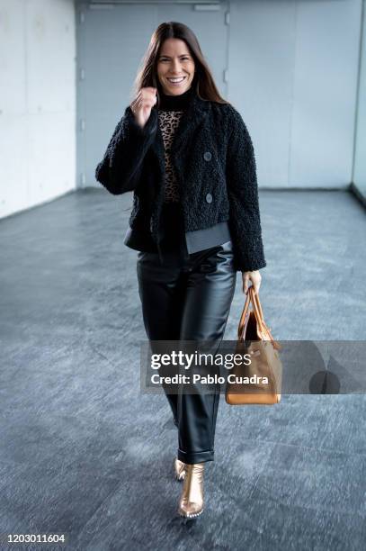 Covi Riva wears Au Revoir Cinderella shoes, Zara trousers, Hermes handbag and Alessandro dell'Acqua coat at IFEMA during Mercedes Benz Fashion Week...